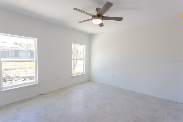 spare room with ceiling fan