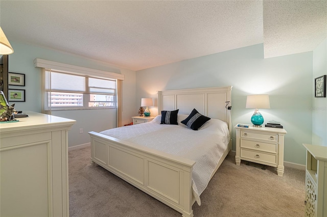 carpeted bedroom featuring a textured ceiling