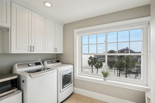 339 55th Ave, St Pete Beach, FL 33706 - washroom with independent washer and dryer, cabinet space, plenty of natural light, baseboards, and recessed lighting