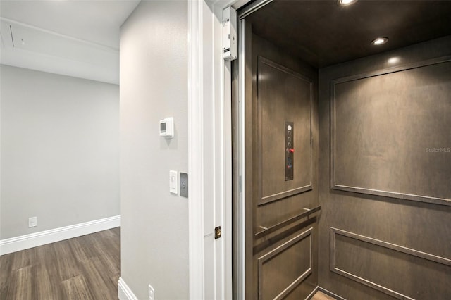 339 55th Ave, St Pete Beach, FL 33706 - elevator featuring wood finished floors, baseboards, and recessed lighting