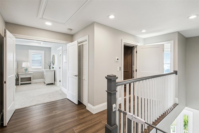 339 55th Ave, St Pete Beach, FL 33706 - corridor featuring an upstairs landing, recessed lighting, dark wood-style floors, baseboards, and attic access