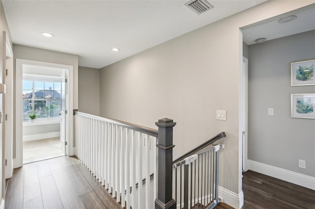 339 55th Ave, St Pete Beach, FL 33706 - hallway featuring an upstairs landing, wood finished floors, recessed lighting, and baseboards