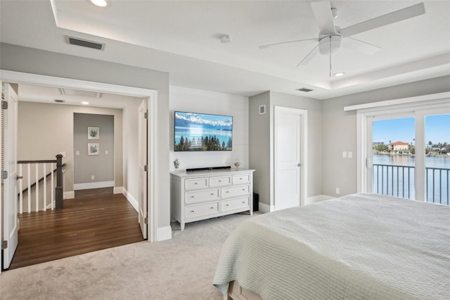 339 55th Ave, St Pete Beach, FL 33706 - bedroom with access to outside, a raised ceiling, carpet floors, baseboards, and recessed lighting