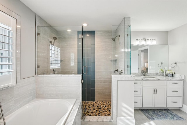 bathroom with vanity, separate shower and tub, and hardwood / wood-style floors