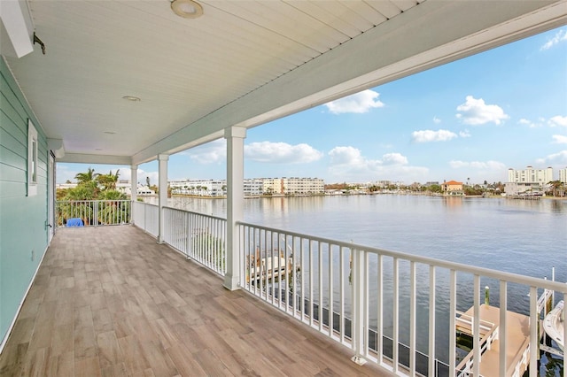 339 55th Ave, St Pete Beach, FL 33706 - wooden terrace with a water view