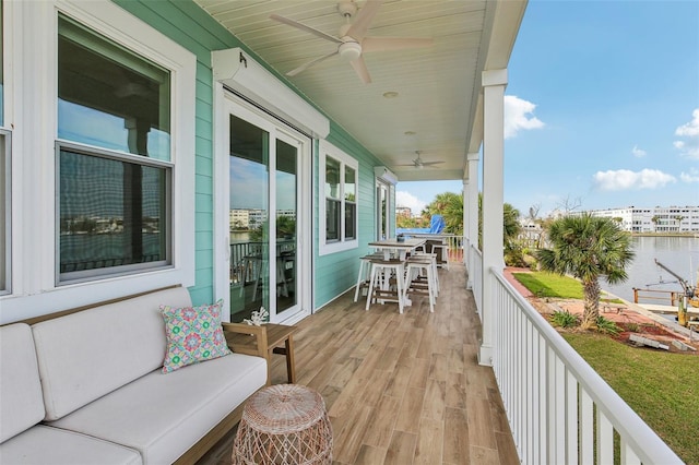 339 55th Ave, St Pete Beach, FL 33706 - balcony featuring a ceiling fan and outdoor dining area