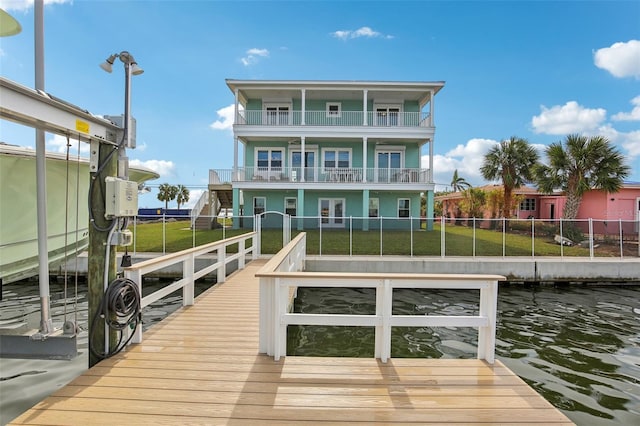 339 55th Ave, St Pete Beach, FL 33706 - dock area featuring a balcony and boat lift