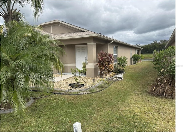 view of home's exterior with a yard