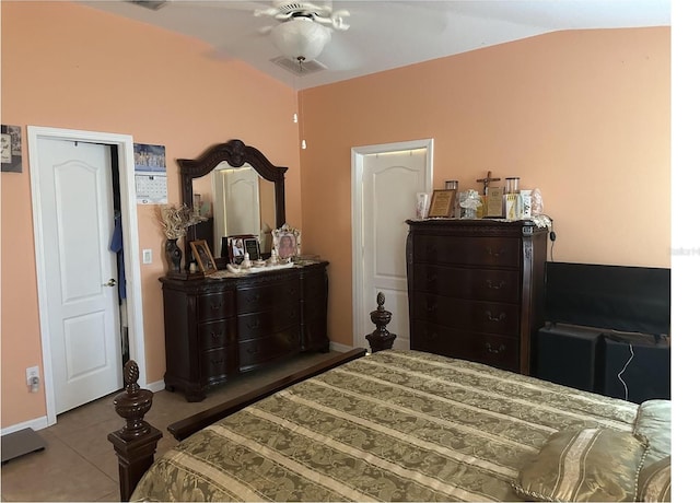 tiled bedroom featuring lofted ceiling and ceiling fan