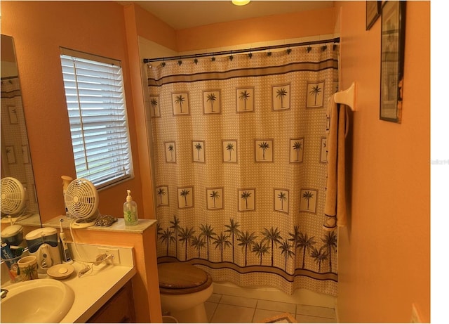 bathroom with vanity, toilet, walk in shower, and tile patterned flooring