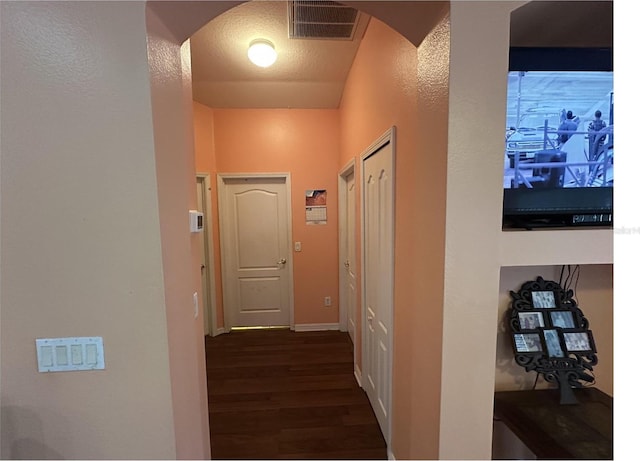 hallway featuring dark hardwood / wood-style floors