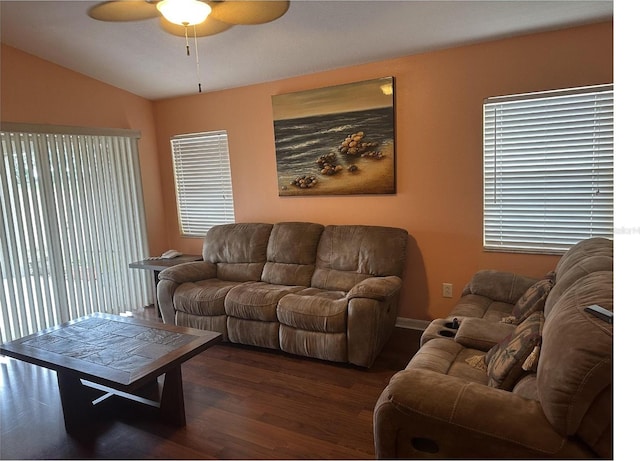 living room with lofted ceiling, dark hardwood / wood-style floors, and ceiling fan