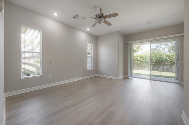 empty room featuring ceiling fan and light wood-type flooring