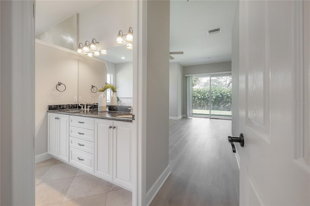 bathroom with vanity and tile patterned flooring