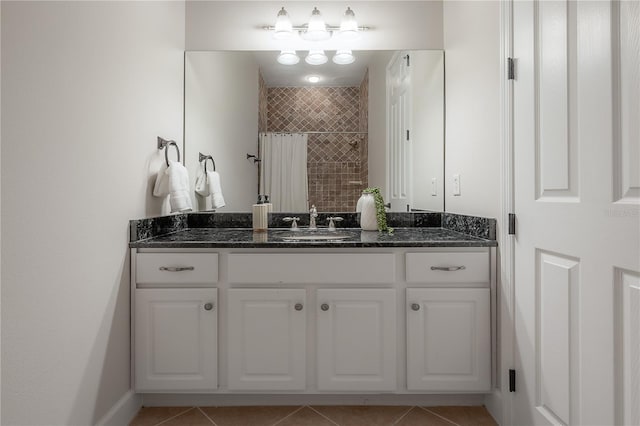 bathroom with vanity, a shower with curtain, and tile patterned flooring