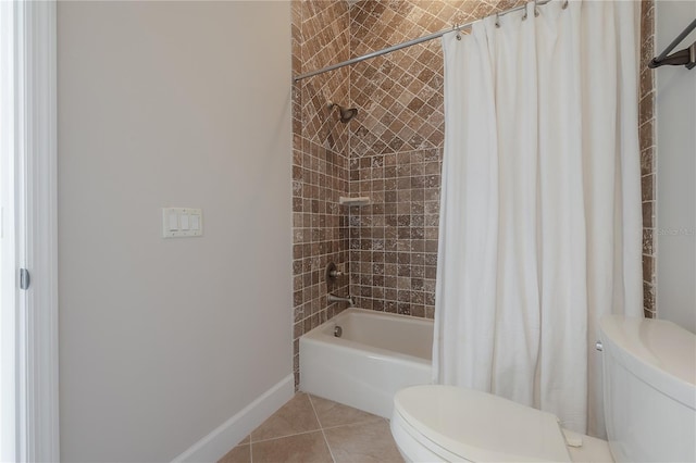 bathroom featuring tile patterned floors, shower / tub combo with curtain, and toilet