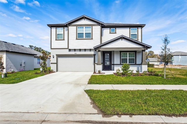 front of property featuring a garage and a front lawn