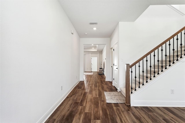 hall with dark wood-type flooring