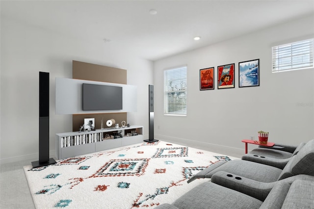 living room featuring a healthy amount of sunlight and light colored carpet