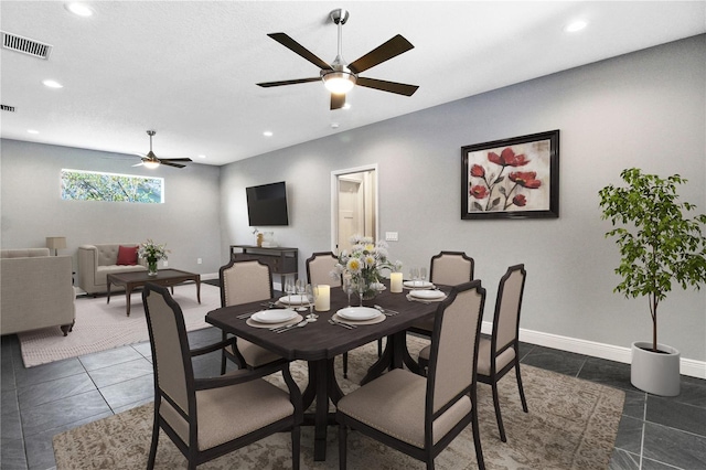 dining space with ceiling fan