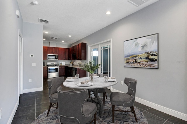 dining room featuring recessed lighting, visible vents, and baseboards