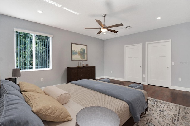 bedroom featuring baseboards, visible vents, dark wood-type flooring, and recessed lighting