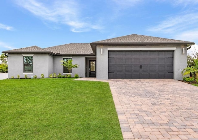 prairie-style home with a garage and a front yard