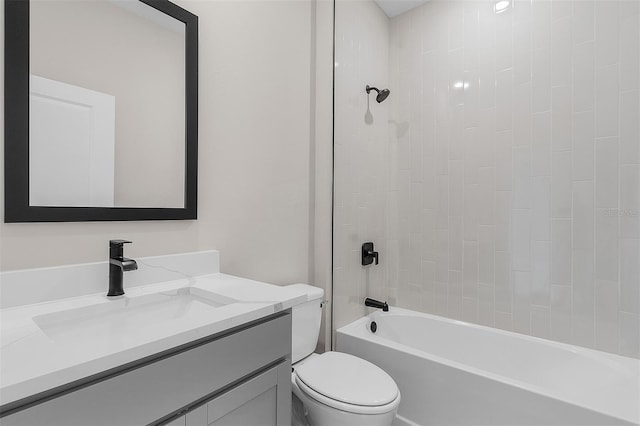 full bathroom with tiled shower / bath combo, vanity, and toilet