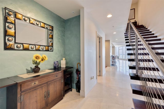 hall featuring light tile patterned floors