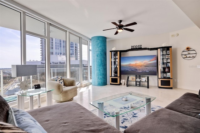 living room featuring expansive windows, a healthy amount of sunlight, and ceiling fan