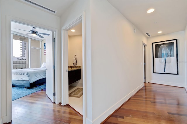 corridor featuring hardwood / wood-style flooring