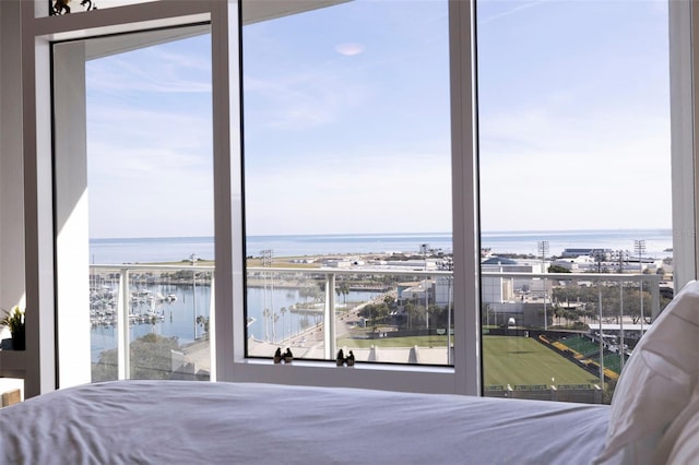 unfurnished bedroom featuring a water view