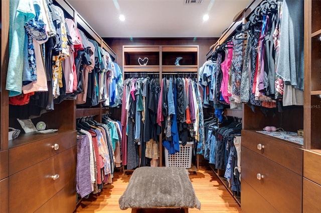 spacious closet featuring light wood-type flooring