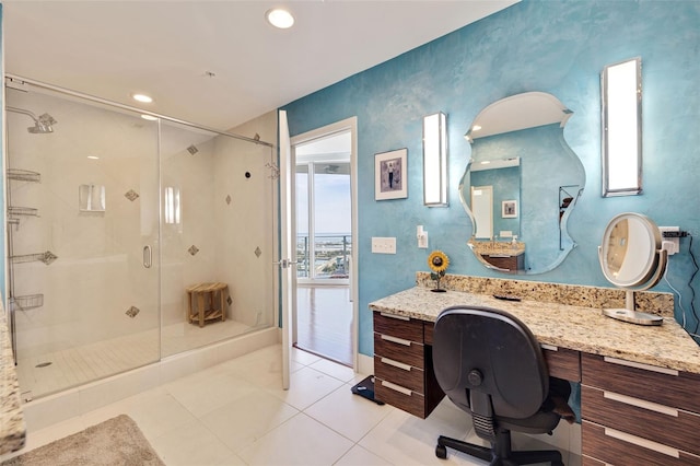 bathroom with vanity, tile patterned flooring, and an enclosed shower