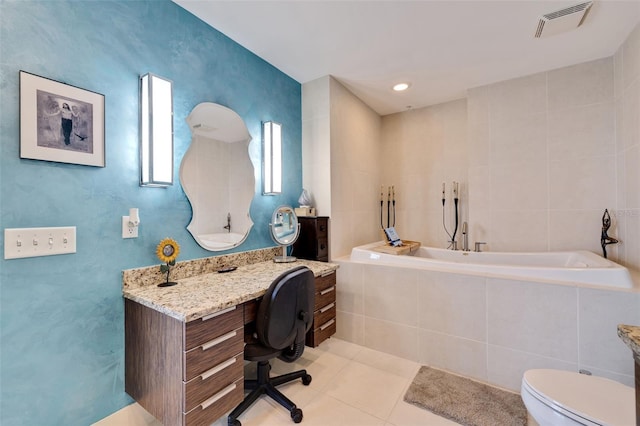 bathroom with a relaxing tiled tub, toilet, tile walls, tile patterned floors, and vanity