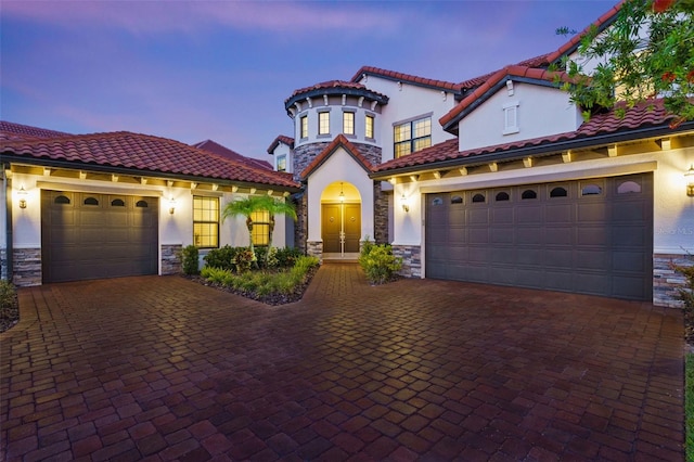 mediterranean / spanish-style house featuring a garage