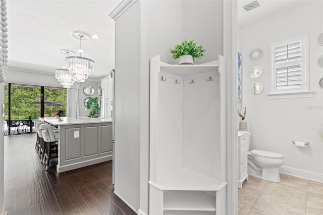 interior space featuring an inviting chandelier and dark hardwood / wood-style floors