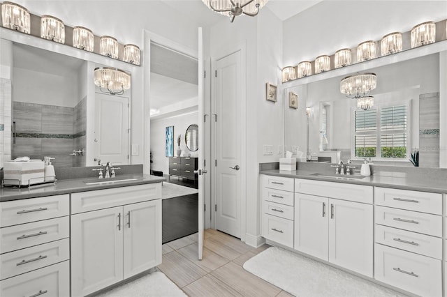 bathroom with vanity, tile patterned floors, and tiled shower