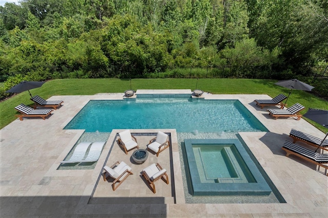 view of pool featuring an in ground hot tub, a patio, and a yard