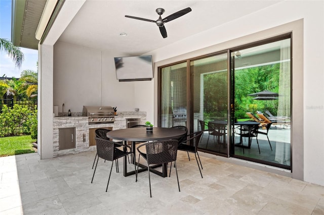 view of patio / terrace with sink, a grill, an outdoor kitchen, and ceiling fan