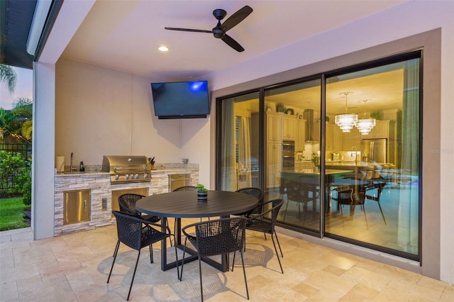 view of patio / terrace featuring an outdoor kitchen, sink, grilling area, and ceiling fan