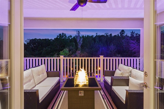 exterior space with outdoor lounge area and ceiling fan