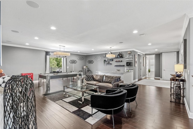 living room with crown molding and hardwood / wood-style flooring