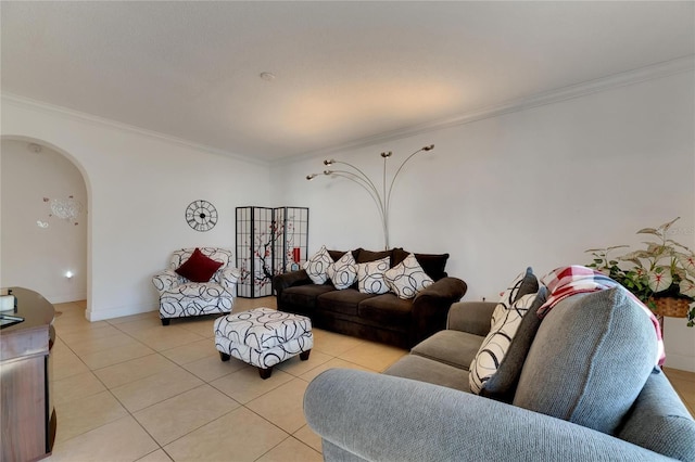 living room with ornamental molding and light tile patterned floors