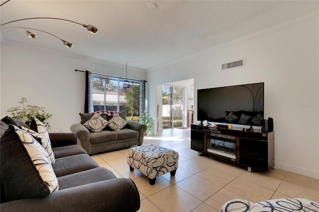 living room featuring ornamental molding and light tile patterned floors