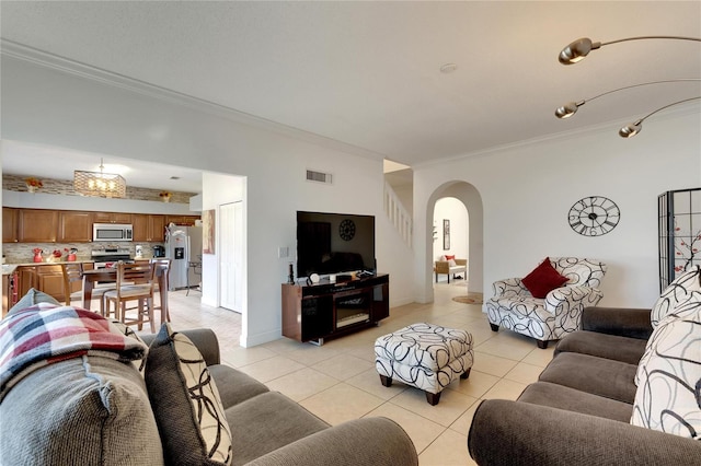 tiled living room featuring ornamental molding