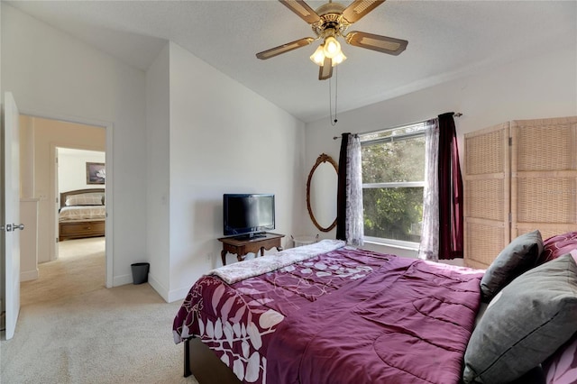 carpeted bedroom featuring lofted ceiling and ceiling fan