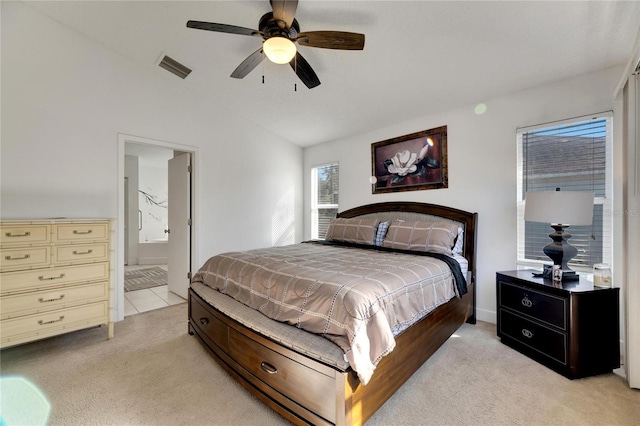 carpeted bedroom with connected bathroom and ceiling fan