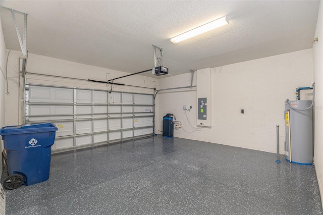 garage featuring a garage door opener, water heater, and electric panel