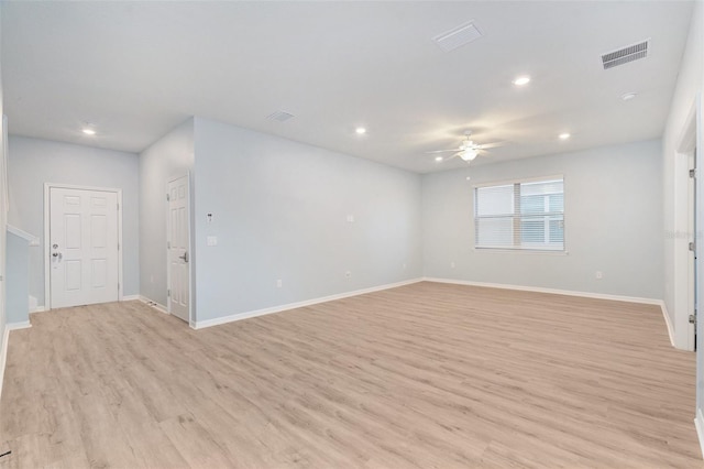 unfurnished room with light wood-type flooring and ceiling fan